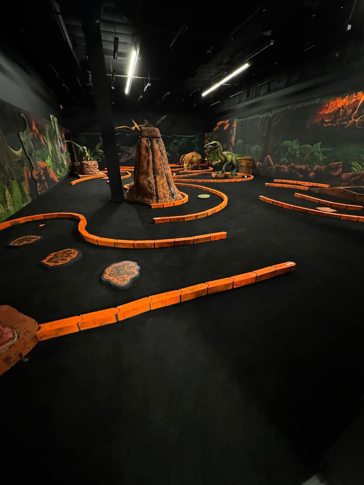 A large room with a lot of orange bricks on the floor.