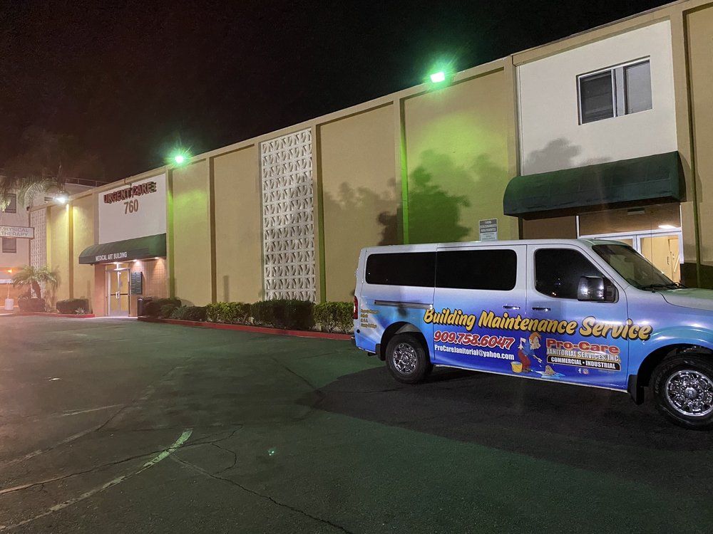 A van parked in front of a building that says safety maintenance services