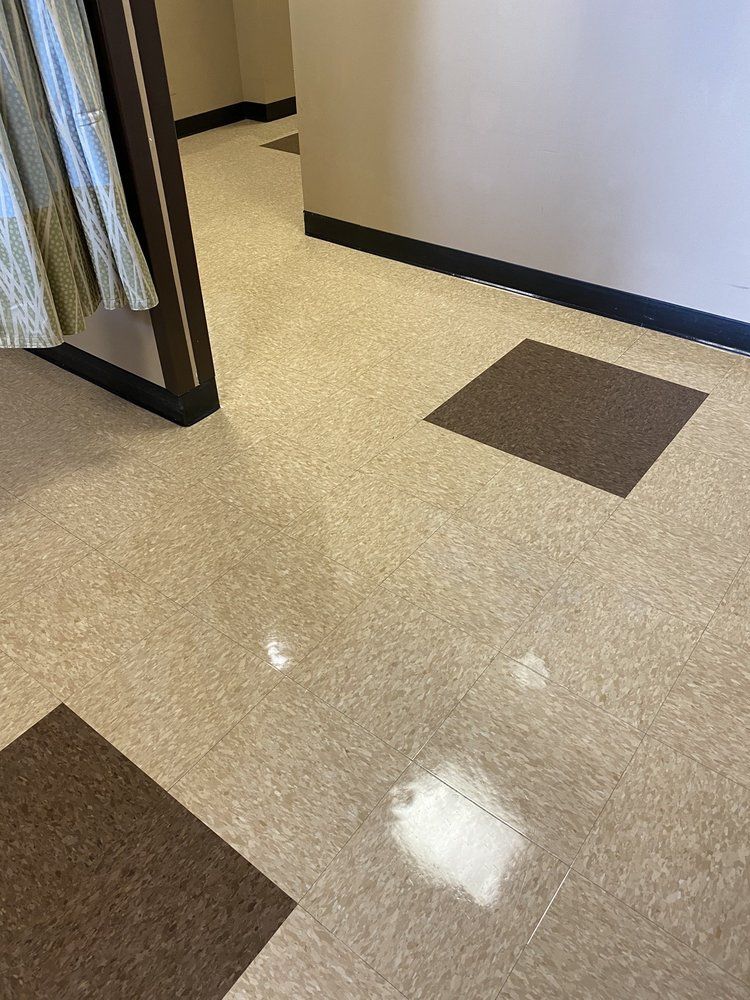 A close up of a tiled floor in a room.