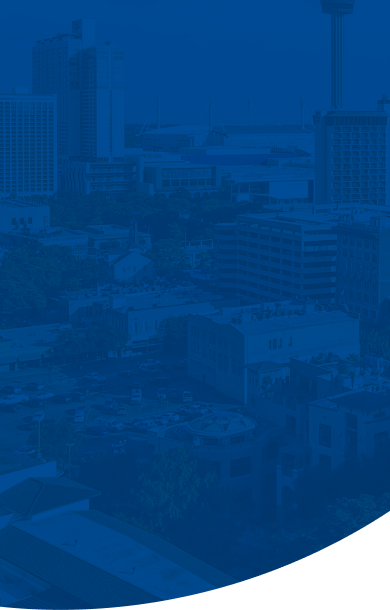 An aerial view of a city skyline overlaid with a deep blue color filter and a curved bottom edge.