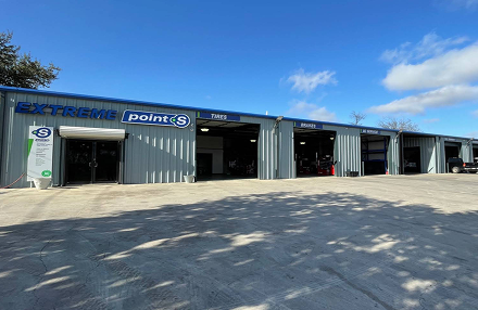 A grey metal commercial building featuring 