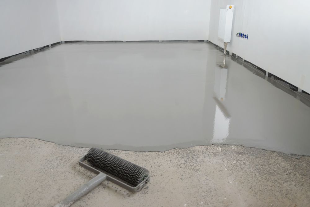 A Broom is Sitting on Top of a Concrete Floor — Brett Rayner Cement Rendering In Alstonville, NSW