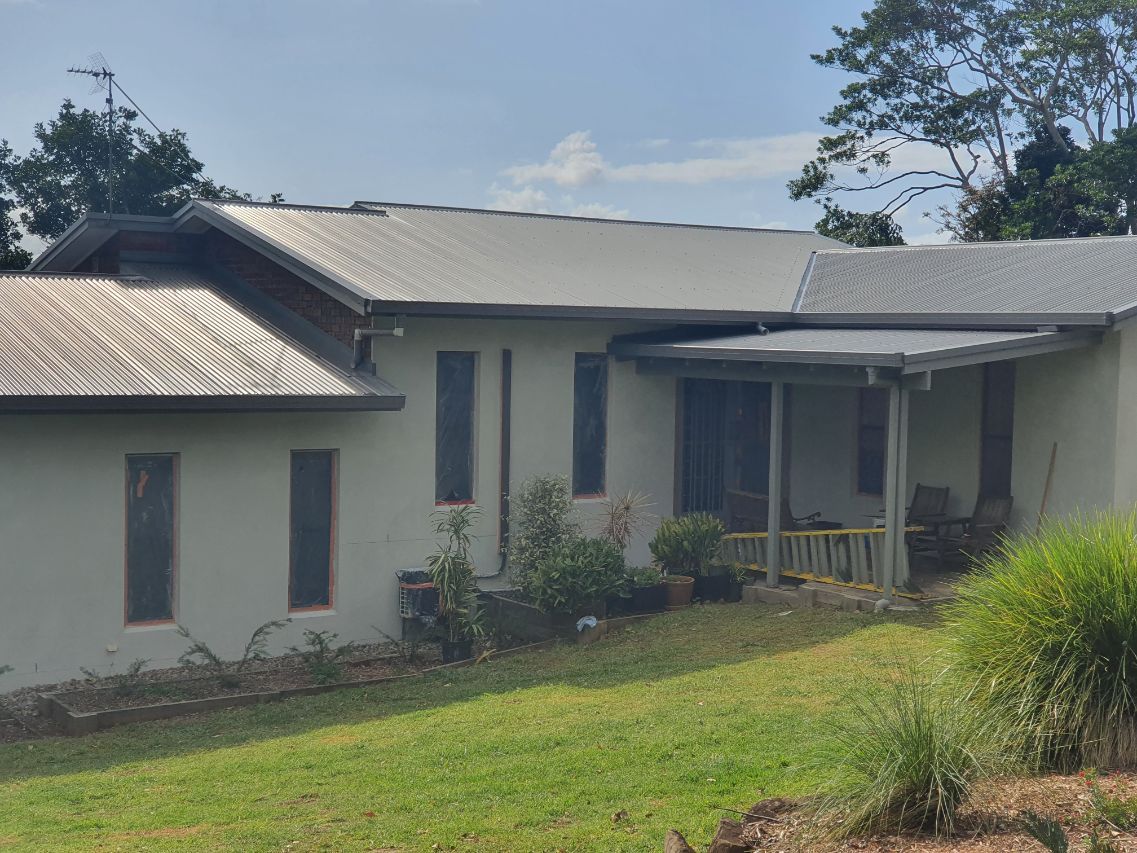 A White House With a Porch and a Lot of Windows — Brett Rayner Cement Rendering In Goonellabah, NSW
