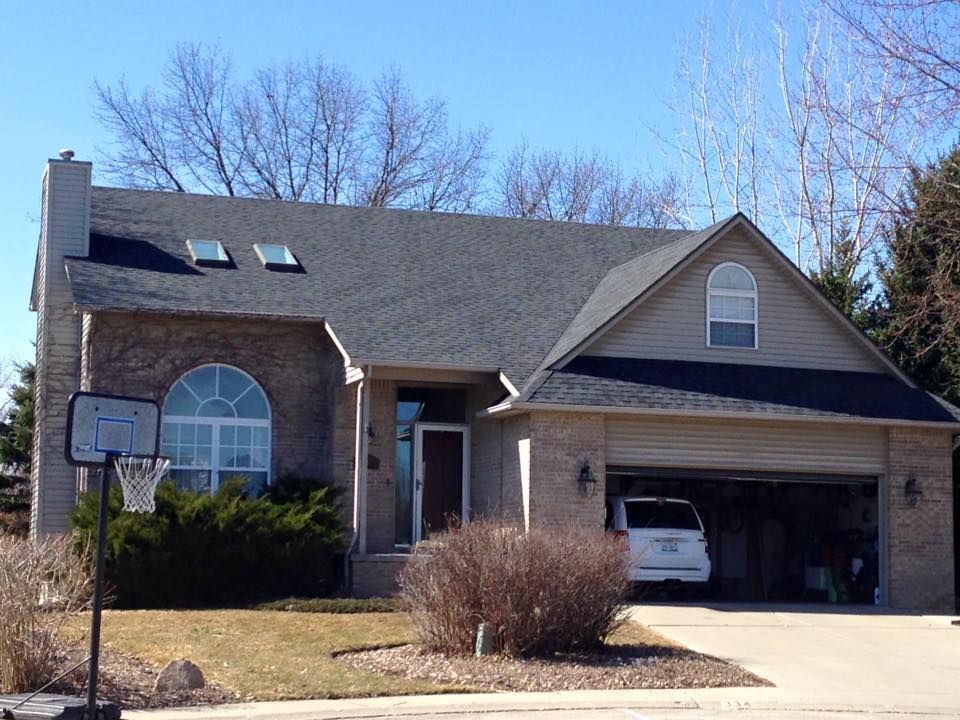 A house with a basketball hoop in front of it