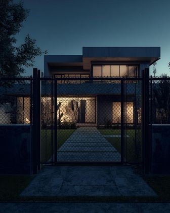 Modern house at dusk, gated with a lit pathway leading to the front door.