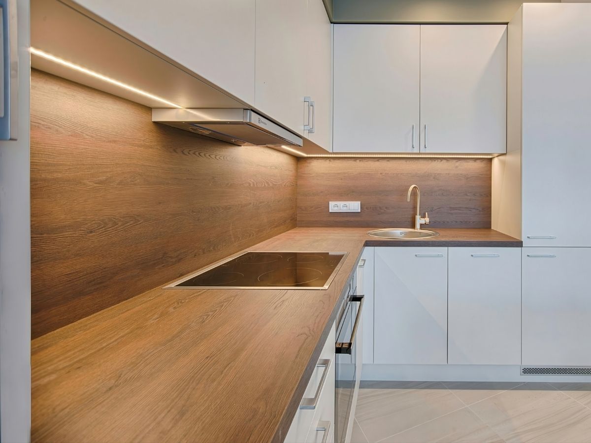 Technician Installing A Ceramic Cooktop For A Local Homeowner Sunshine Coast