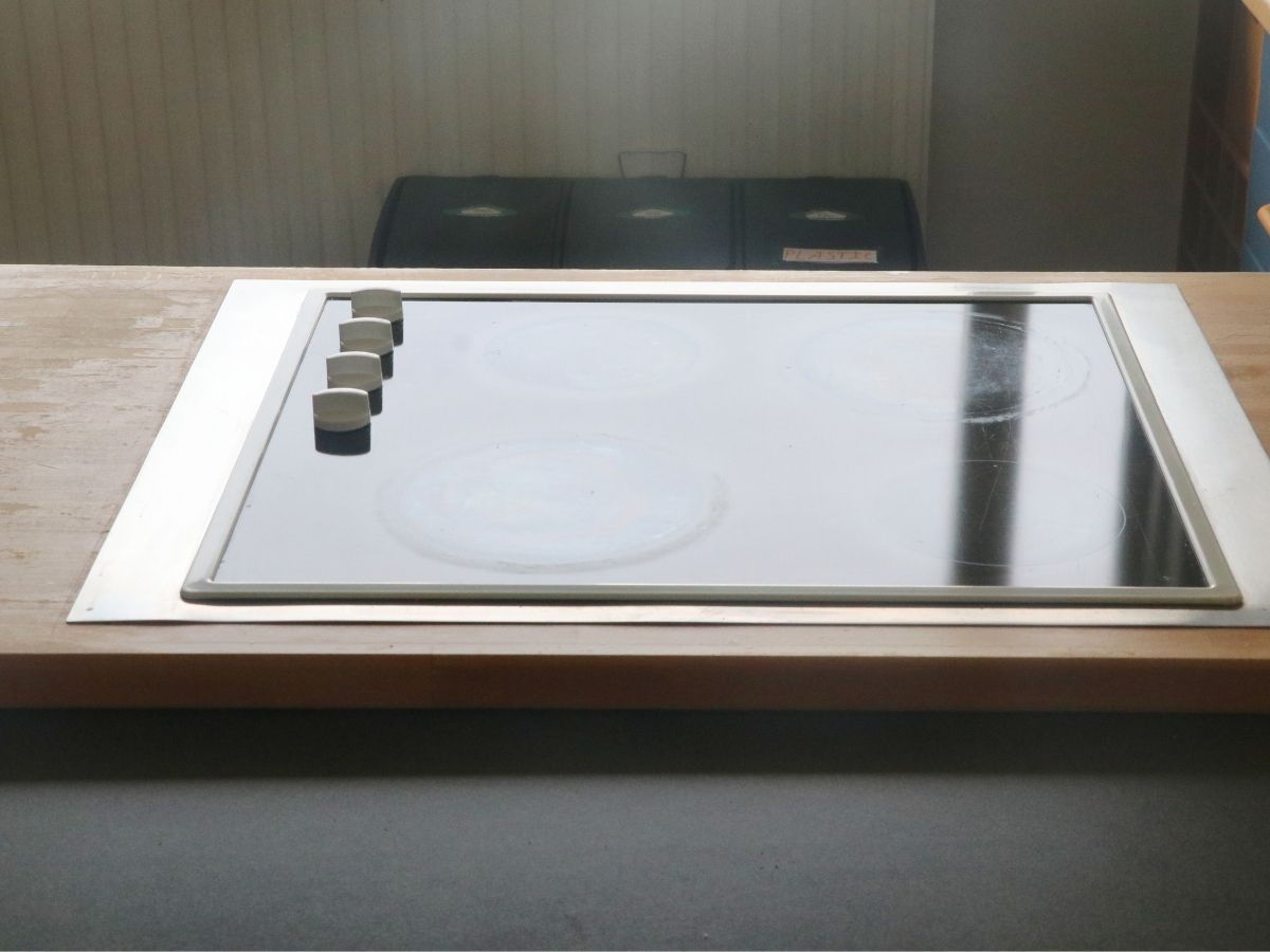 Electrician Correcting Unsafe Cooktop Installation For Homeowner Sunshine Coast