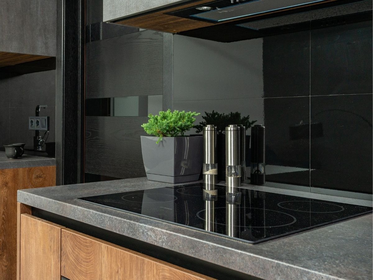 New Cooktop Being Fitted Securely In A Contemporary Apartment Kitchen Sunshine Coast