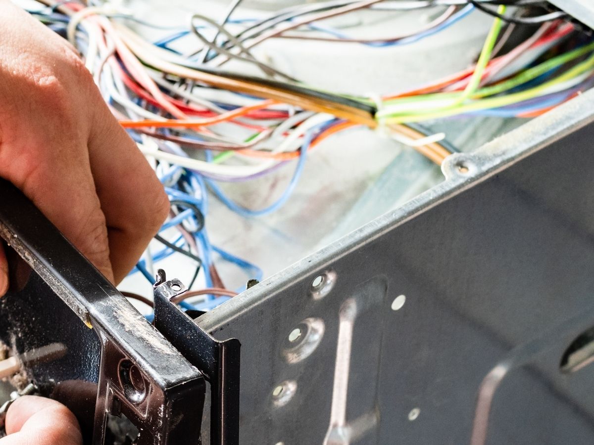 Electrician Upgrading Wiring To Support New Cooktop Installation Sunshine Coast