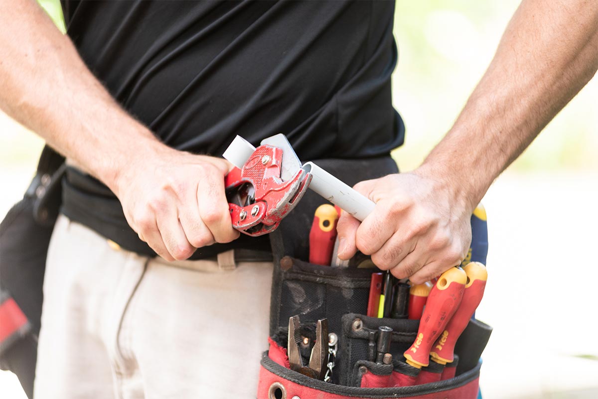 Electrician Cutting PVC Conduit