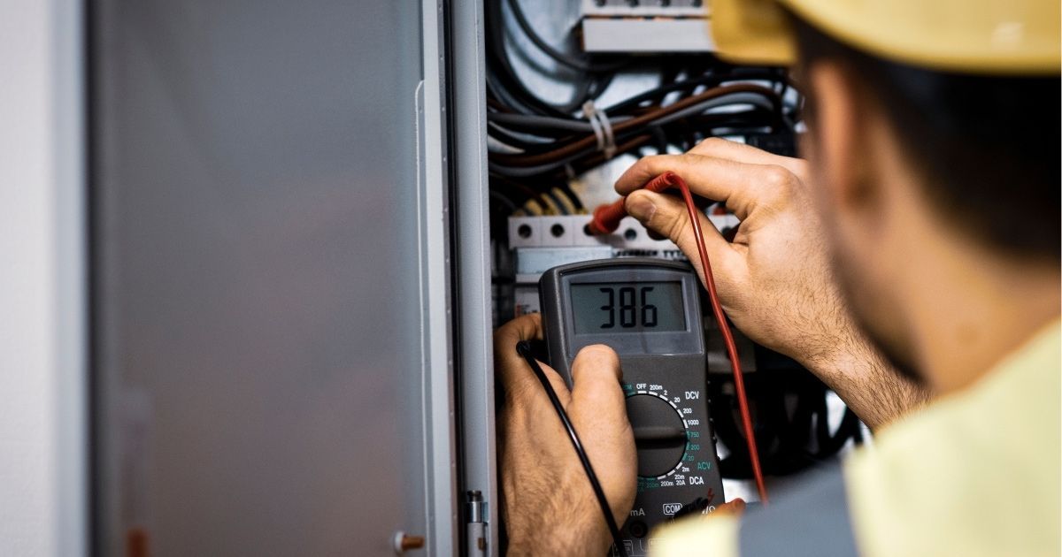 Commercial Electrician Inspecting Electrical System In Local Factory Sunshine Coast