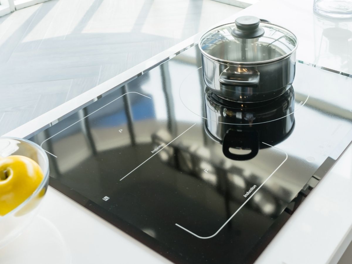 Electrician Adjusting Benchtop Cutout For New Induction Cooktop Sunshine Coast