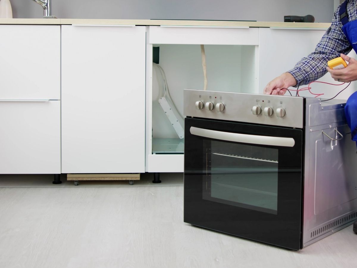 Electrician Installing New Electric Oven In Sunshine Coast Home