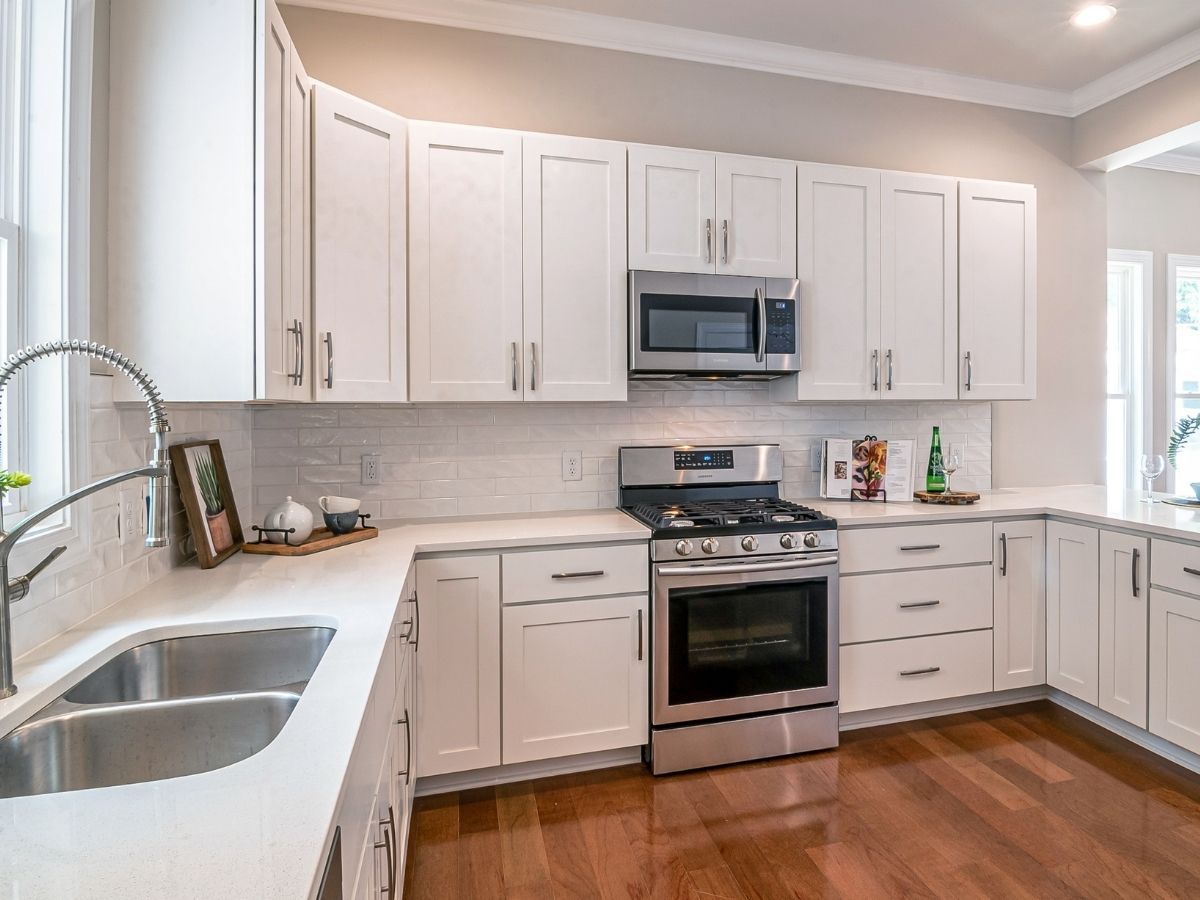 Electrician Levelling And Securing Oven For Safe Operation Sunshine Coast