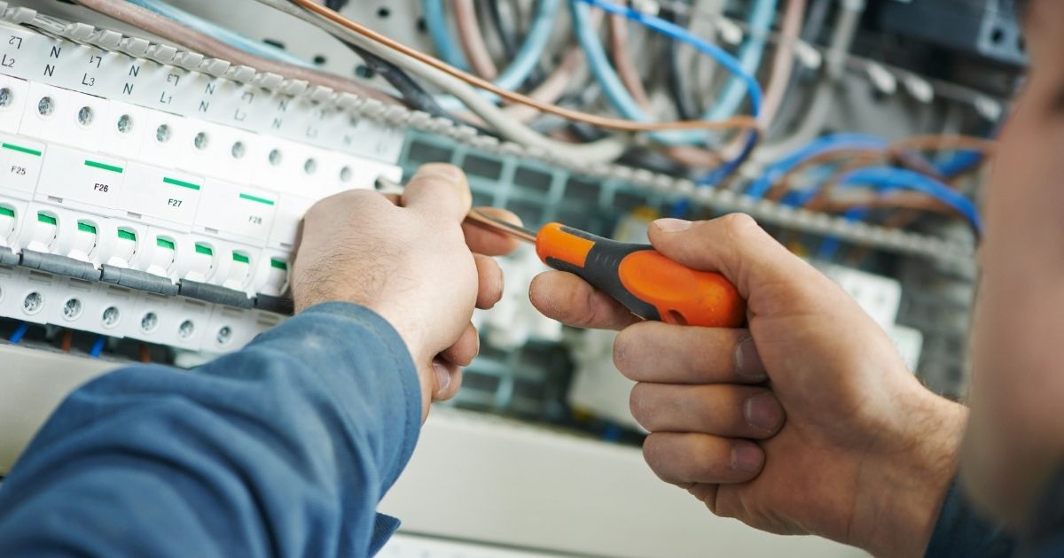 Electrician Upgrading Office To Energy Efficient LED Lighting Sunshine Coast