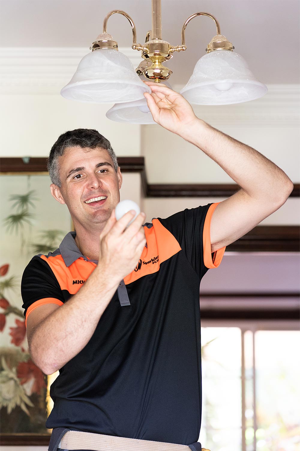 Residential Electrician Sunshine Coast Working On Light Fitting