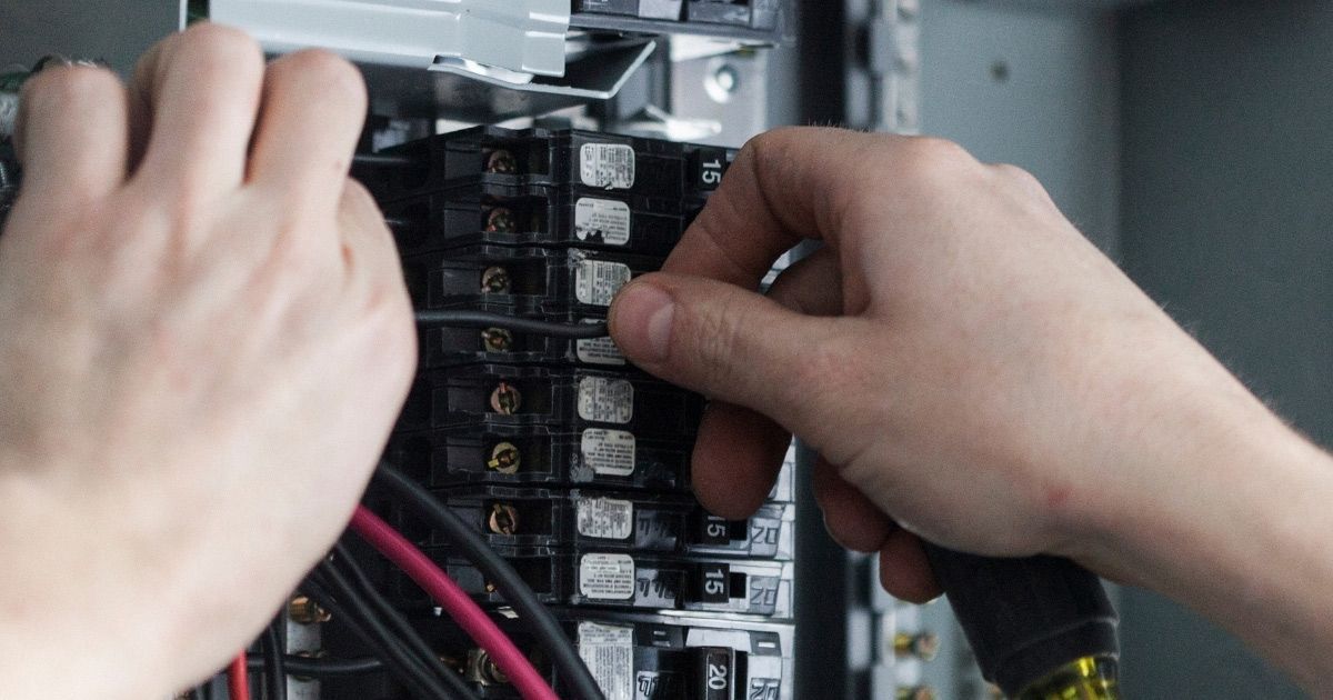 Commercial Electrician Repairing Faulty Wiring In Local Retail Store Sunshine Coast