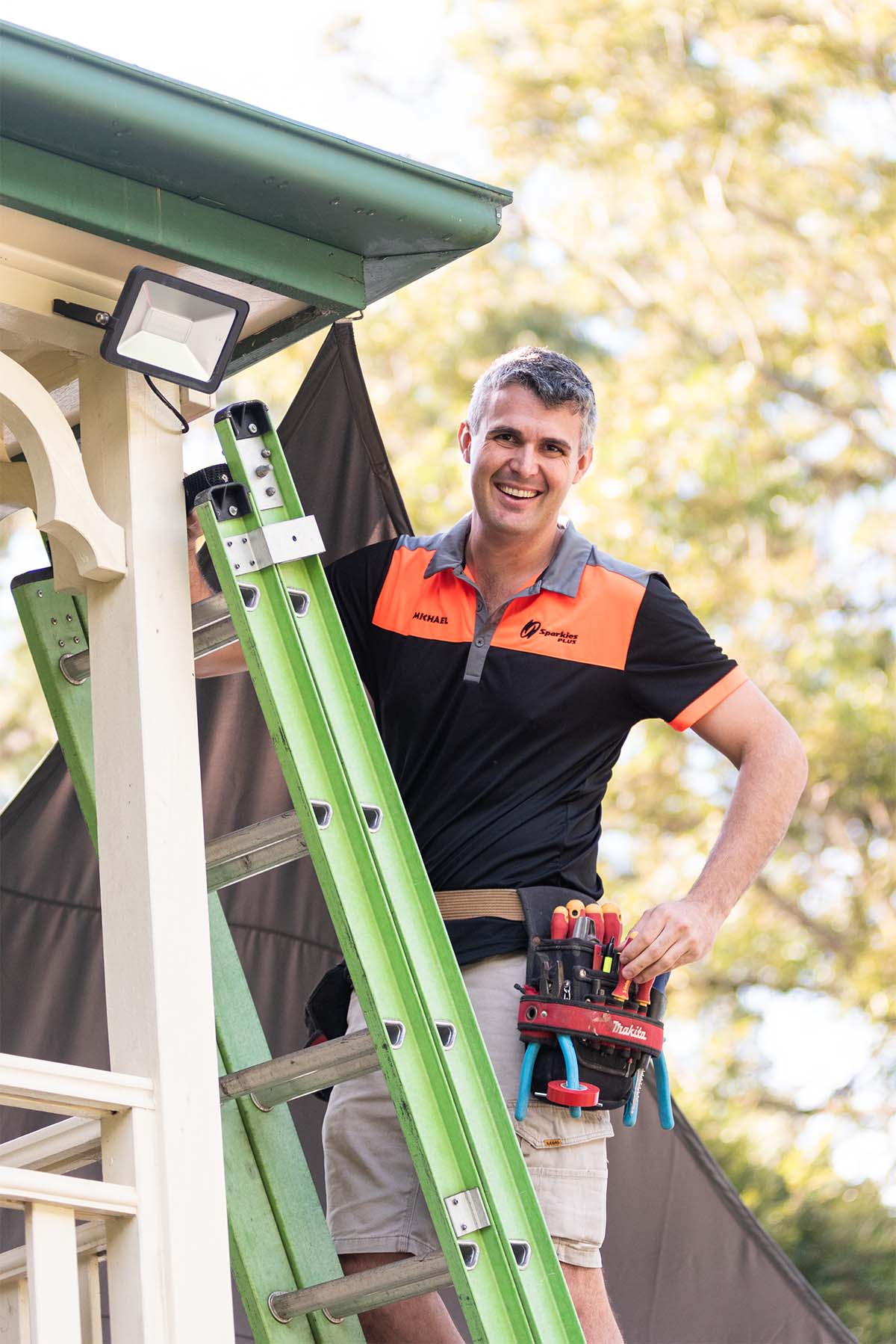 Sunshine Coast Electrician Sparkies Plus On A Ladder Installing A Security Sensor Light