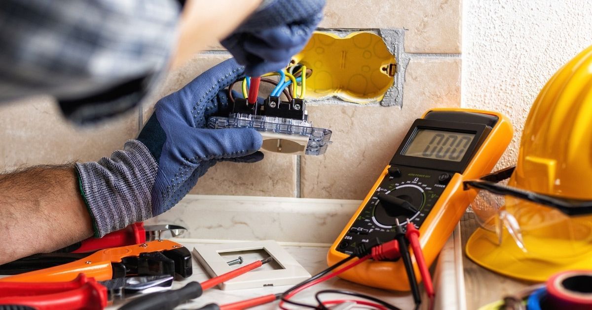 Business Owner Receiving Workplace Electrical Safety Review From Expert Sunshine Coast