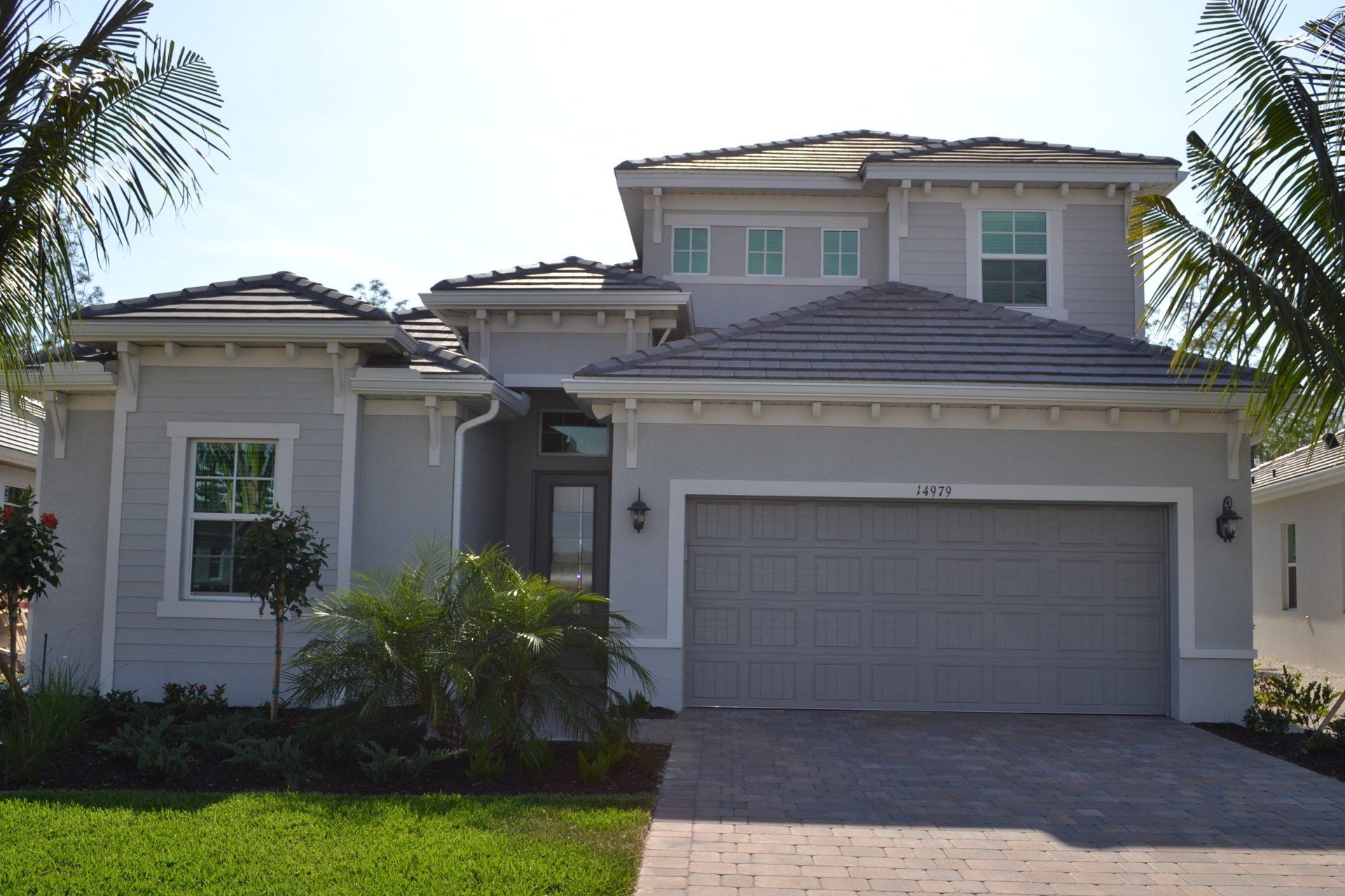 A large house with a garage and a driveway