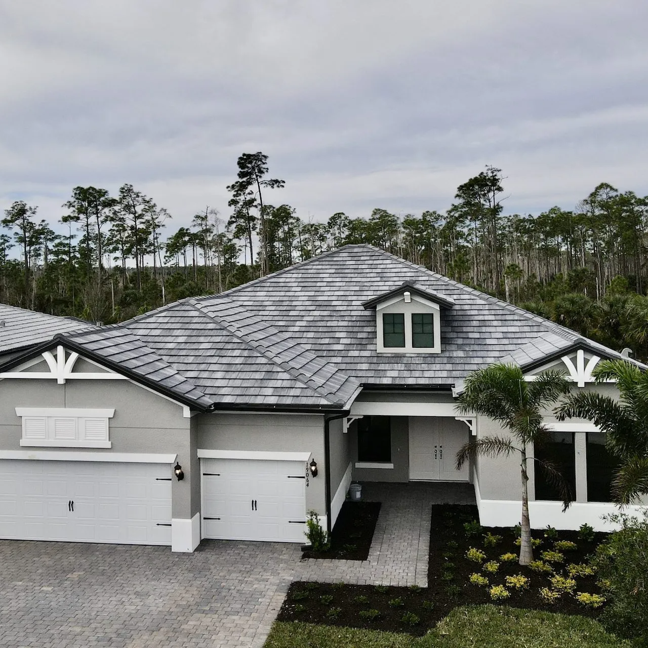 An aerial view of a house with a slate roof