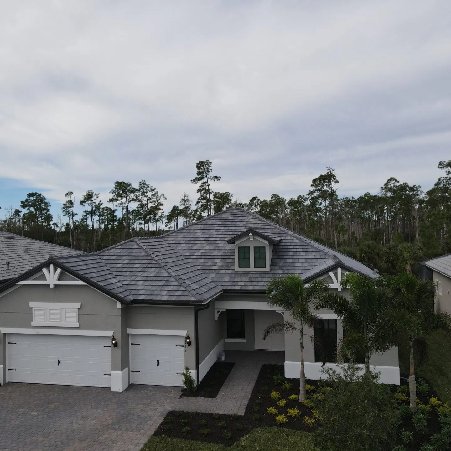 An aerial view of a house with a slate roof