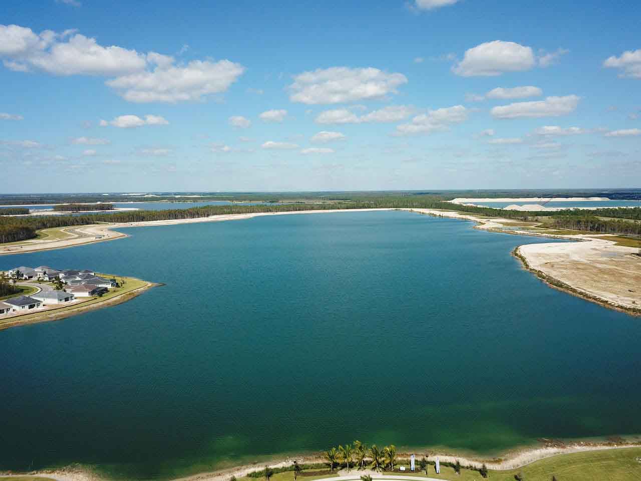 An aerial view of a large body of water with a small island in the middle.