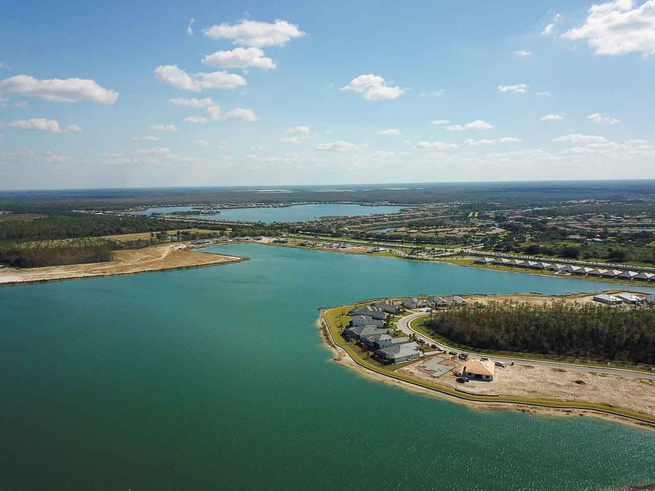 An aerial view of a large body of water with a small island in the middle.