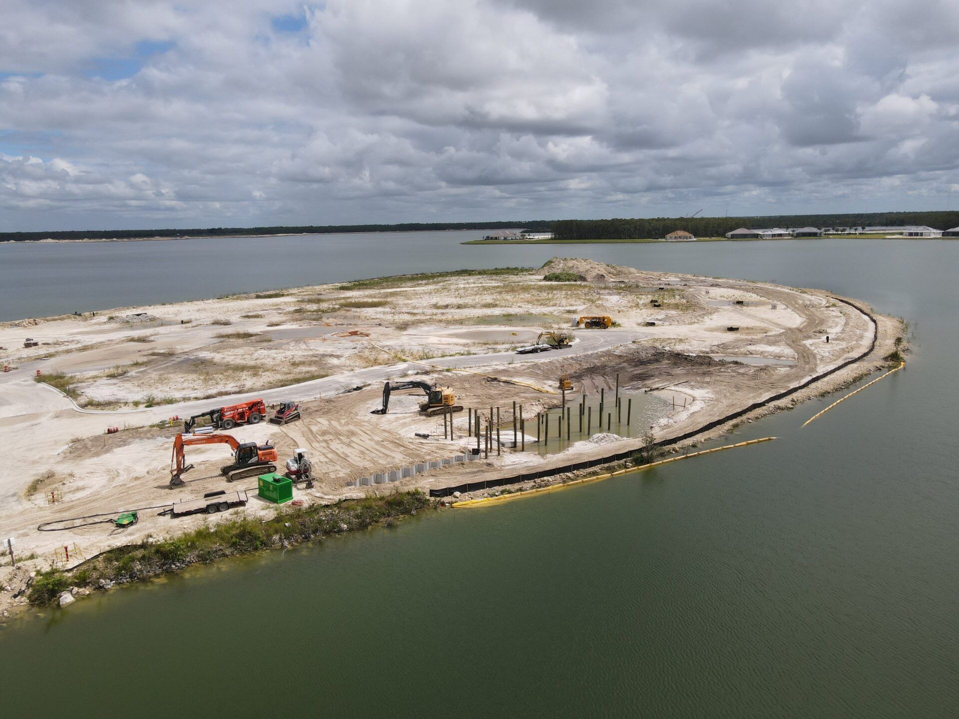 An aerial view of a small island in the middle of a body of water.