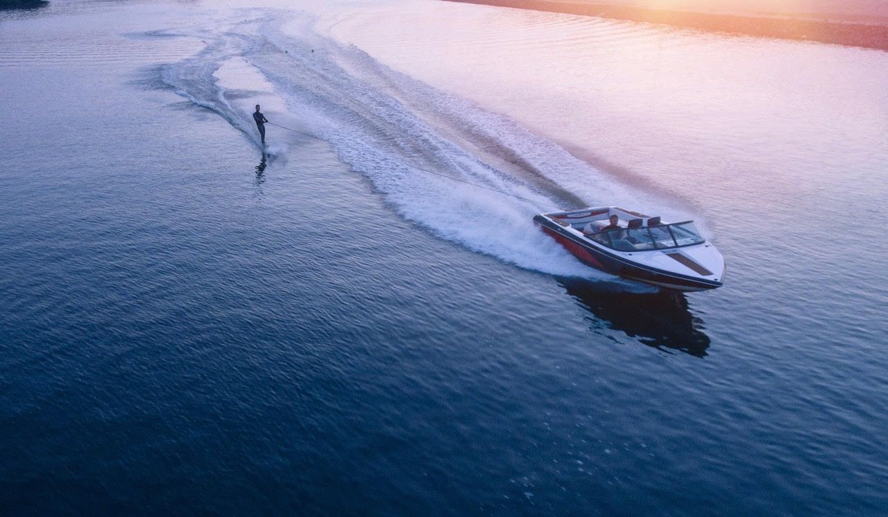 An aerial view of a boat floating on top of a body of water.