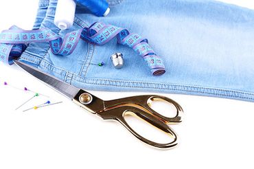 Men suit being measured for alterations