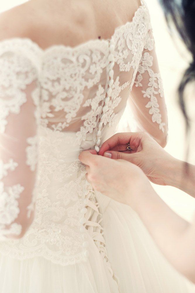 Women trying on the bridal dresses for a perfect fit
