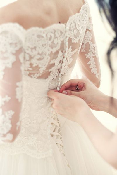 Women trying on the bridal dresses for a perfect fit