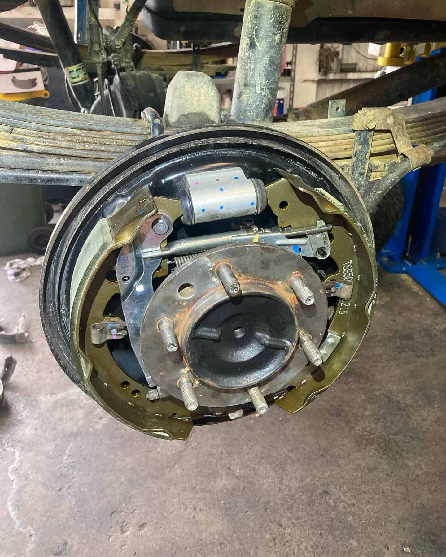 A Close Up Of A Brake Caliper On A Car In A Garage — NEID Automotive In North Gosford, NSW