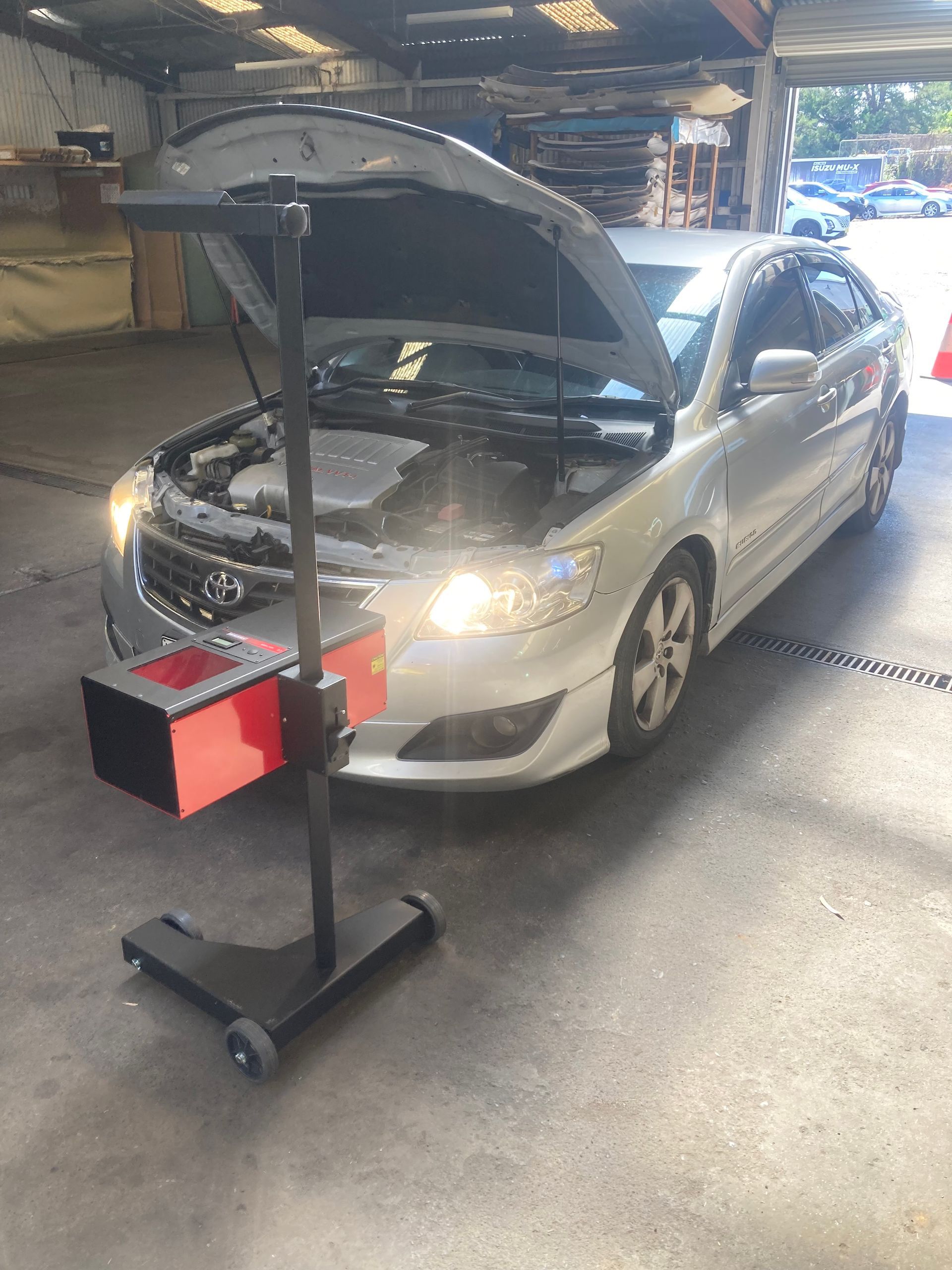 A Silver Car Has The Bonnet Open With Headlights On — NEID Automotive In North Gosford, NSW