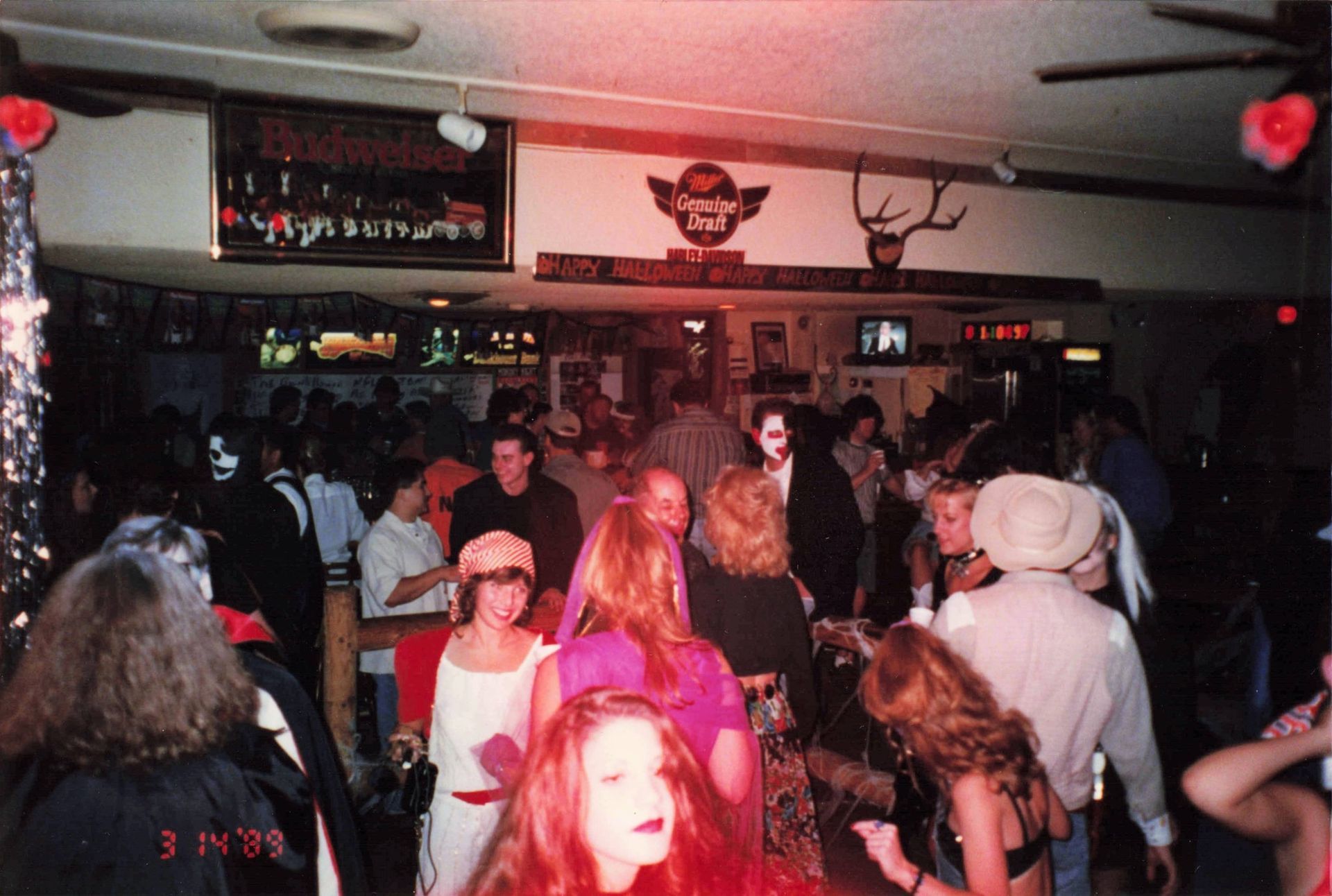 A crowd of people are gathered in a room