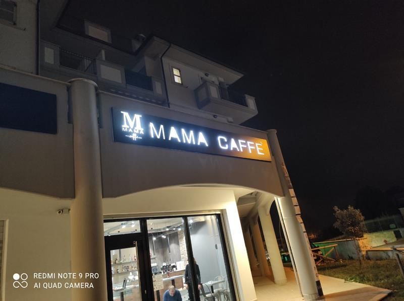 insegna negozio in ferro