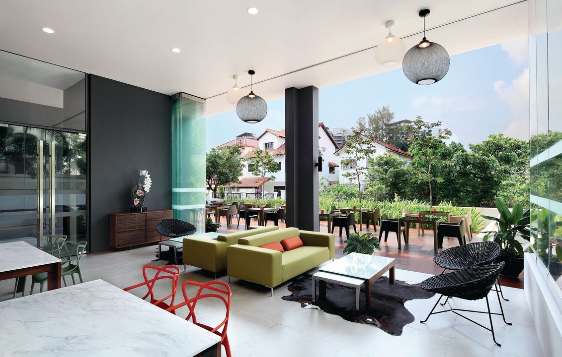 A living room with a lot of furniture and tables