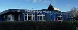 Portishead Youth Centre with blue exterior, white windows, and sign.
