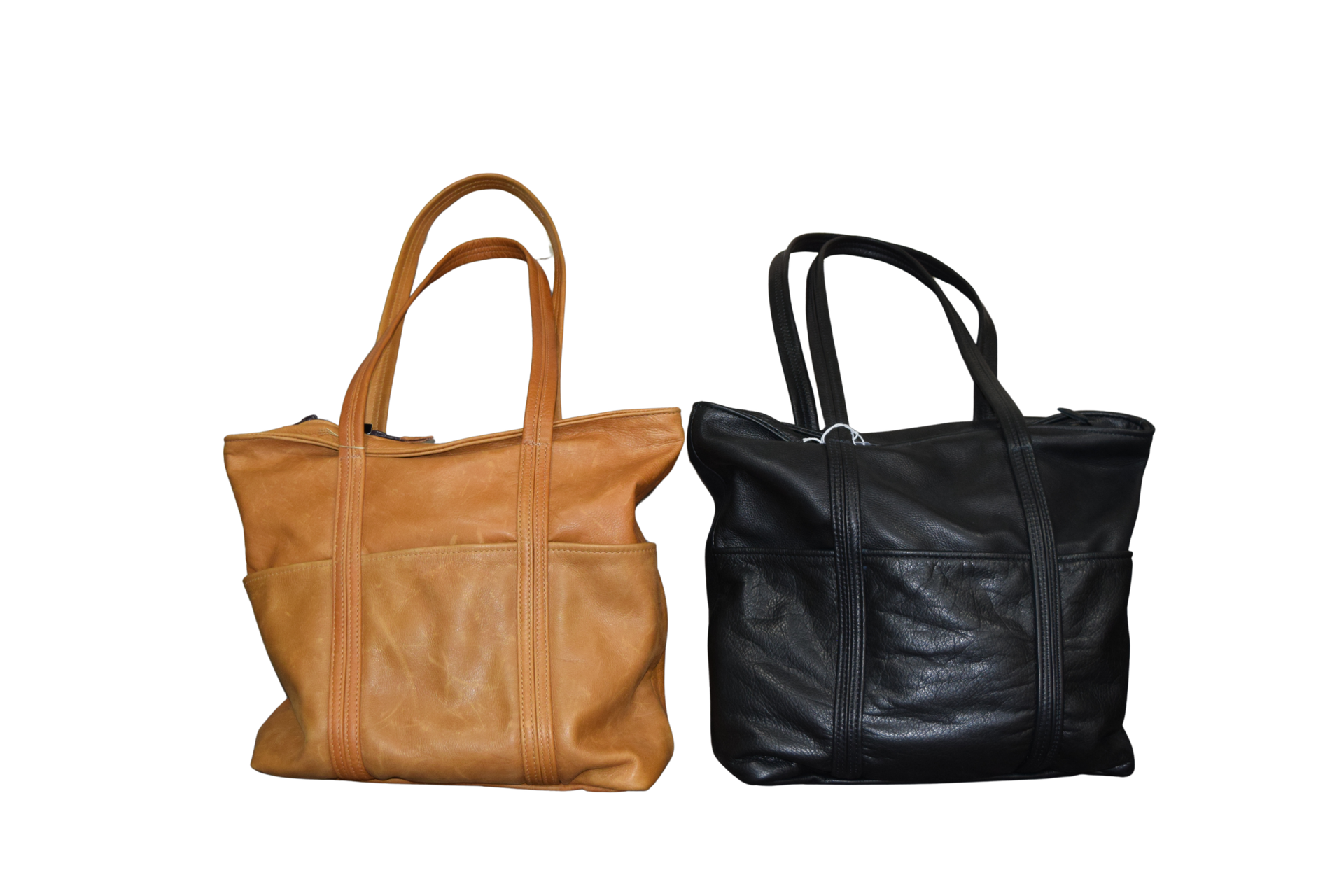 Two leather tote bags: one tan, one black, both with handles and exterior pockets.