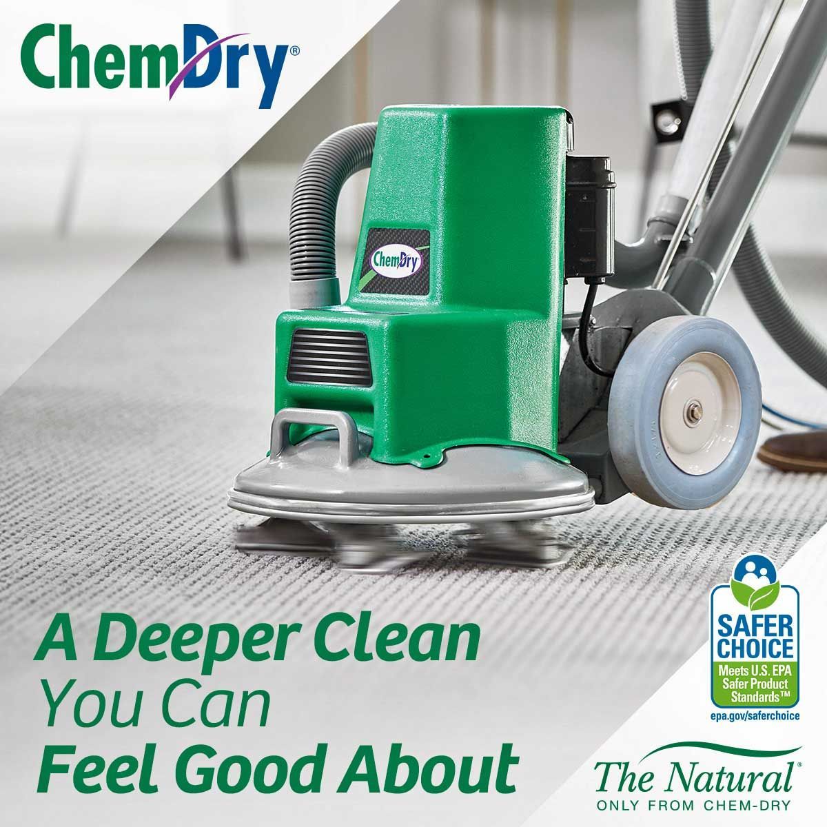 Green Chem-Dry carpet cleaning machine on a gray carpet; text says