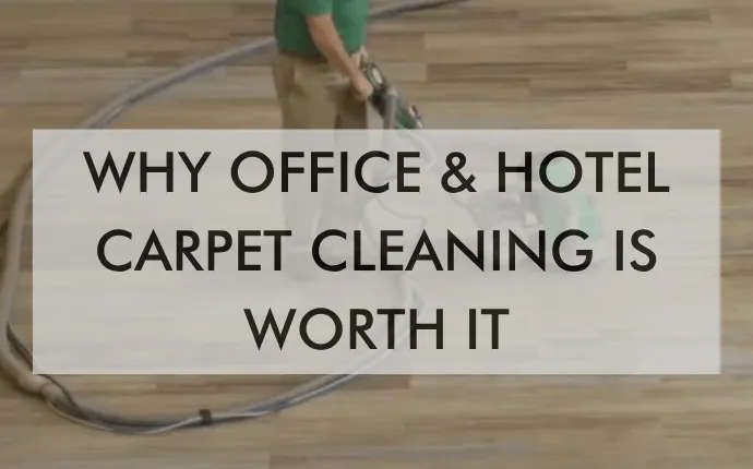 A Chem-Dry technician is cleaning a wooden floor with a vacuum cleaner.