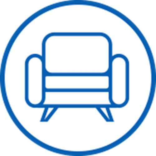Blue line drawing of an armchair inside a blue circle.