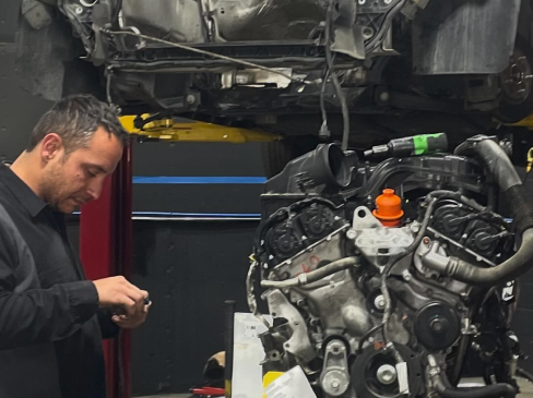 mechanic working on car engine | Jay's Total Car Care