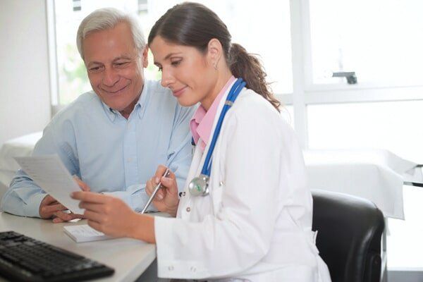 Doctor Talking to Patient — Insurance in Port Orange, FL / Doctor Talking to Patient