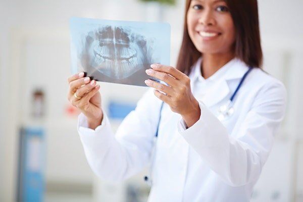Dentist Holding Xray — Insurance in Port Orange, FL