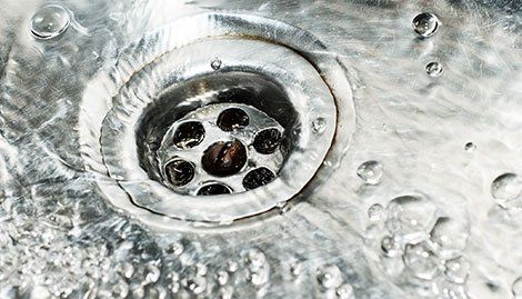 Steel sink - Plumber works in a bathroom - HVAC and Plumbing Contractor in North Troy, NY