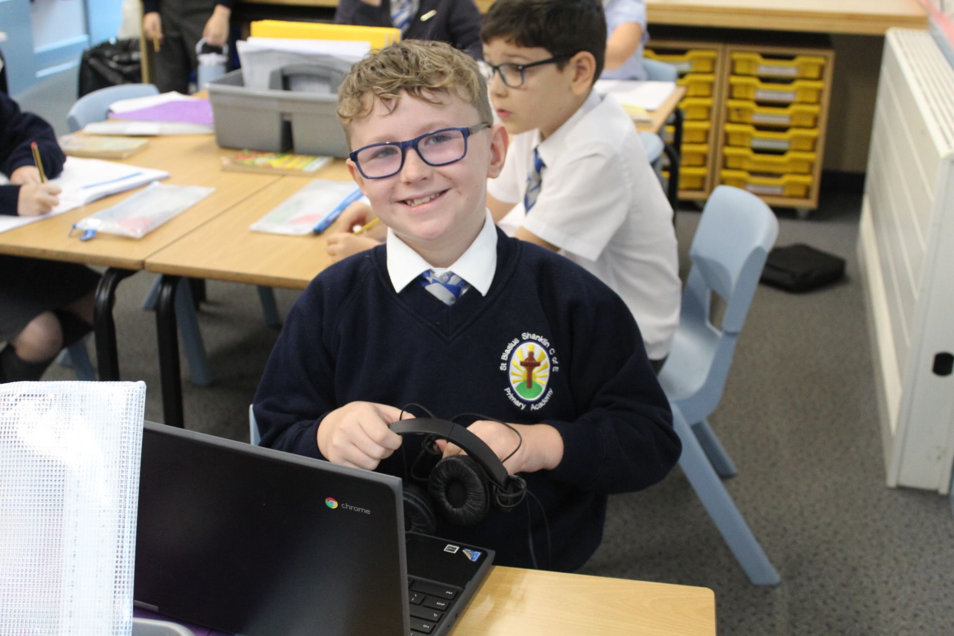 Two children reading books: one 