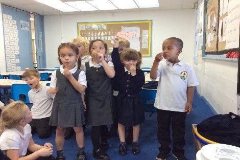 A group of children in a classroom.