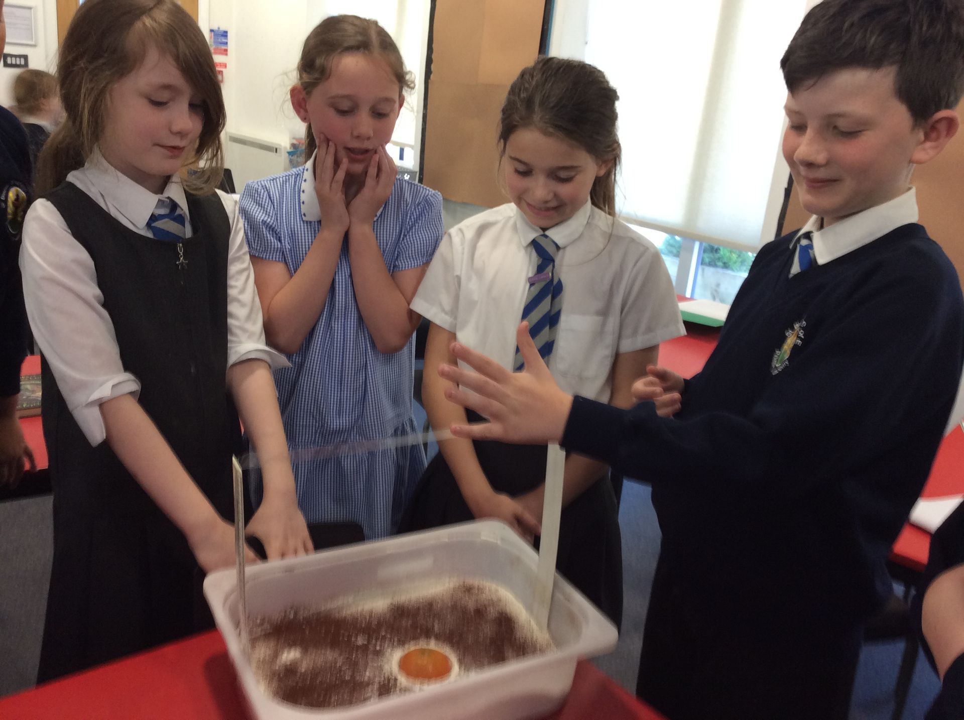 A group of children in school working on a science project